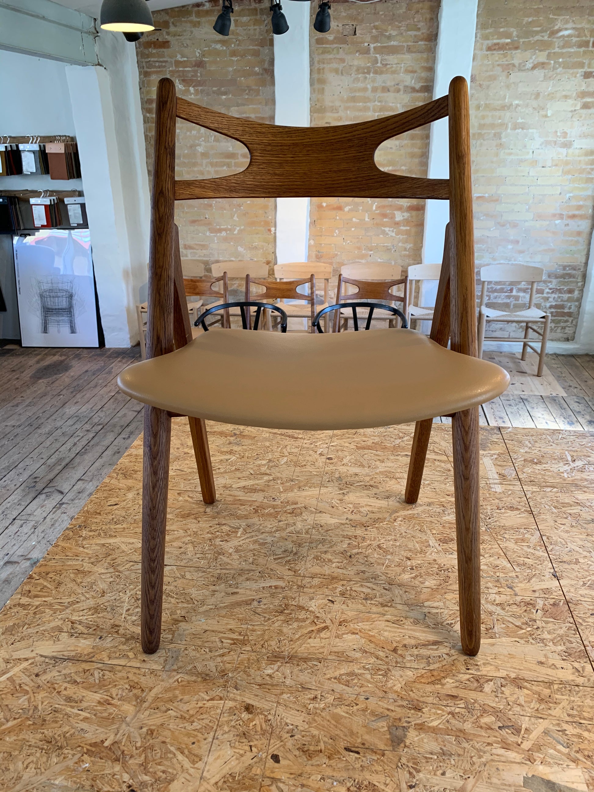 Ompolstring af Wegner Savbukkestol