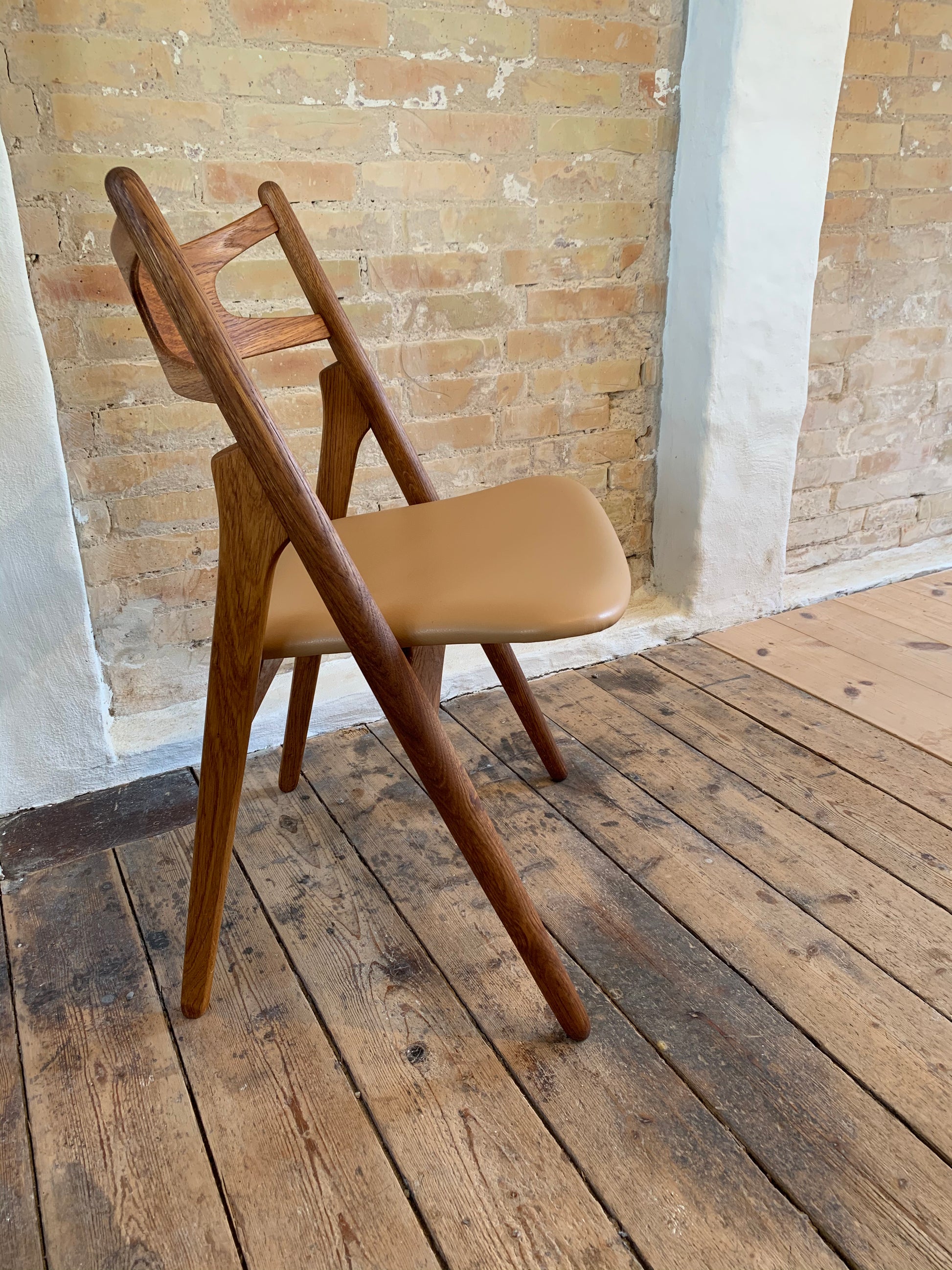 Ompolstring af Savbukkestol